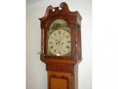 An early 19thC oak and flamed mahogany cross-banded long case clock with