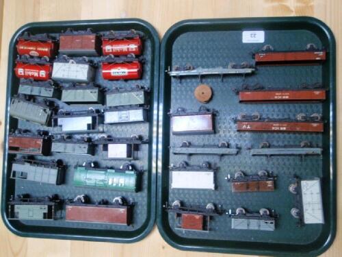 A collection of 00 gauge tin plate and die-cast freight rolling stock