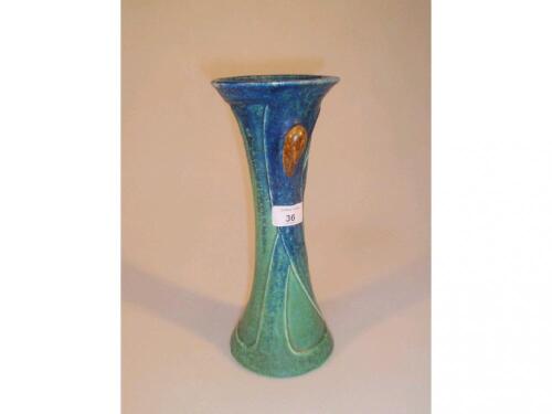 A Bretby stylized Art Nouveau slender tapered vase