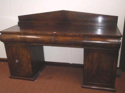 An early Victorian flamed mahogany print pedestal sideboard