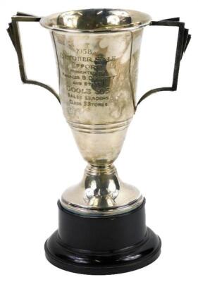 A silver two handled trophy cup