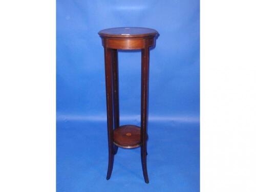 An Edwardian string inlaid mahogany jardiniere stand