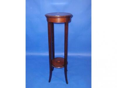 An Edwardian string inlaid mahogany jardiniere stand