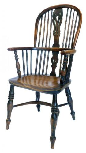 A mid 19thC yew ash and elm Windsor chair