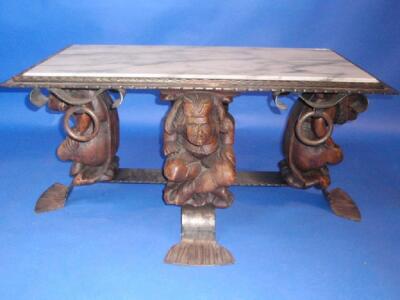 A wrought and anodised coffee table with marble inset top