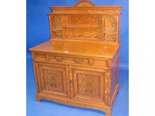 A fine Victorian satinwood side cabinet with raised shelf compartment