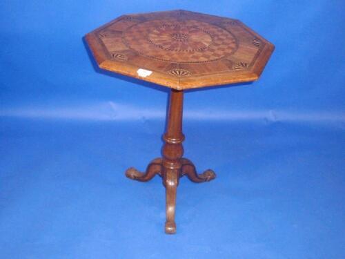 A Victorian parquetry pedestal table inlaid with a variety of woods including mahogany