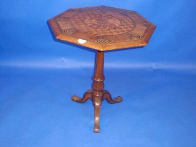 A Victorian parquetry pedestal table inlaid with a variety of woods including mahogany