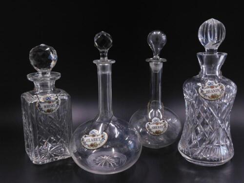 Four glass decanters and stoppers