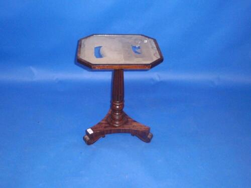 A Victorian flamed mahogany pedestal table with glazed top