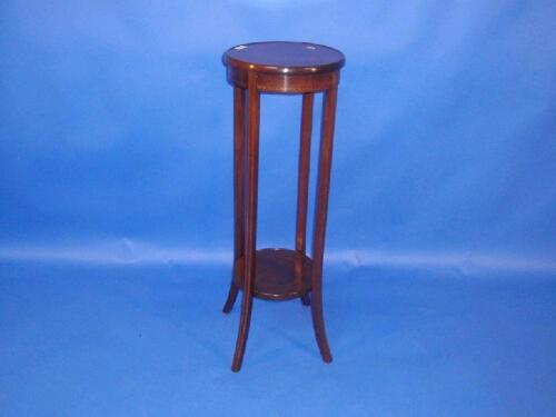 An Edwardian string inlaid mahogany jardiniere stand