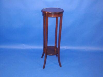 An Edwardian string inlaid mahogany jardiniere stand