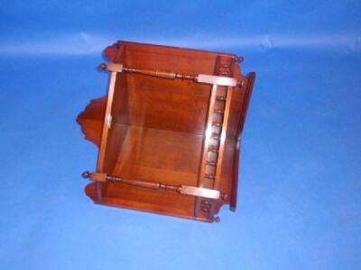 A late Victorian walnut hanging corner shelf with gallery