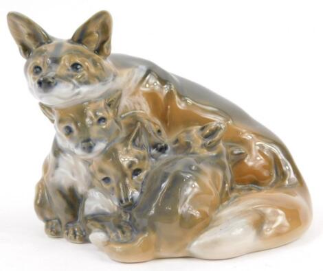 A Royal Copenhagen porcelain figure of a fox and her cubs