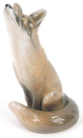 A Royal Copenhagen porcelain figure of a seated fox