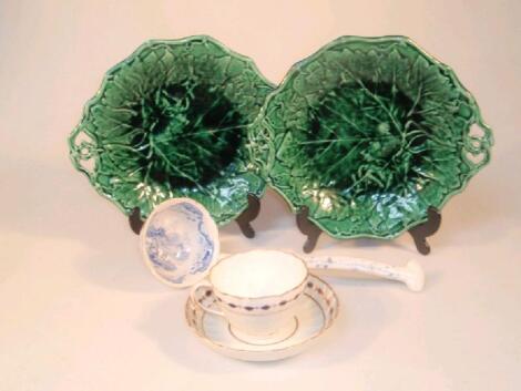 A pair of Davenport green glazed leaf moulded dishes with plates