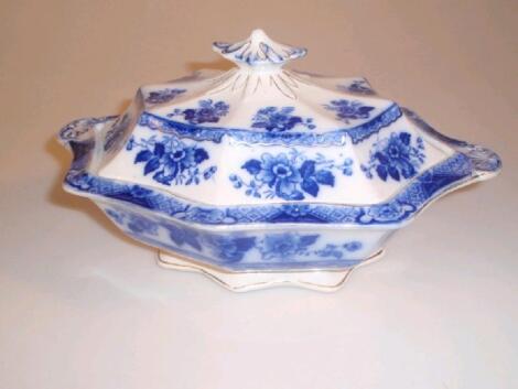 A late 19thC tureen and cover printed in blue with floral sprays and diaper border