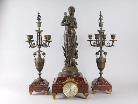 After Eutrope Bouret. A French bronze and marble clock garniture