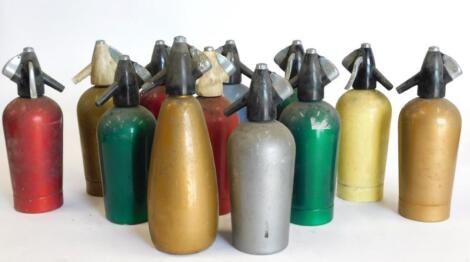 A collection of twelve coloured enamel type soda siphons.