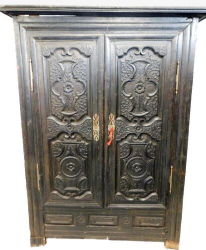 A 19thC Continental ebonised oak armoire