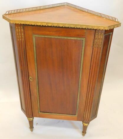 A Continental mahogany and gilt metal corner cabinet