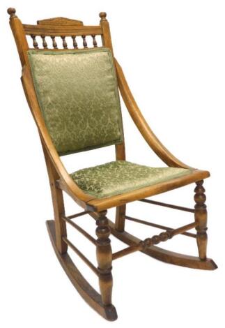 A 20thC beech rocking chair