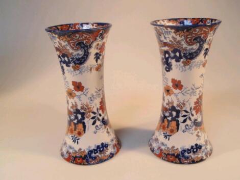 A pair of Staffordshire pottery vases