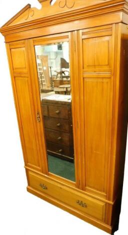 An Edwardian walnut wardrobe