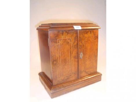 A 19thC walnut and rosewood table cabinet with a caddy top over two doors