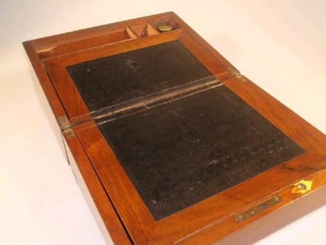 A 19thC mahogany writing box with brass banding and corners