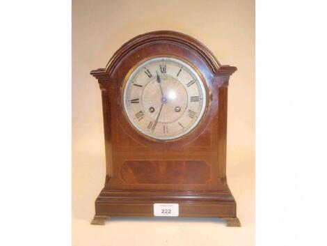 An early 20thC mahogany mantel clock of eight-day movement striking on