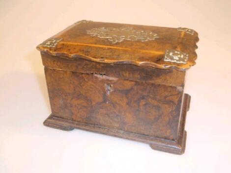 An early 19thC scrumble painted walnut effect tea caddy of rectangular form