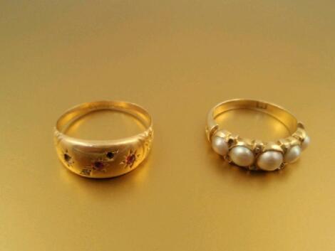 A Victorian ? pearl (5) and diamond chip set ring in yellow metal stamped 18