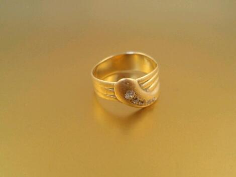 An 18ct yellow gold diamond set snake ring