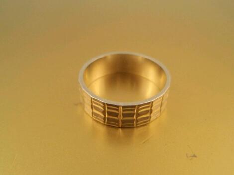 A ladies 18ct white gold wedding band