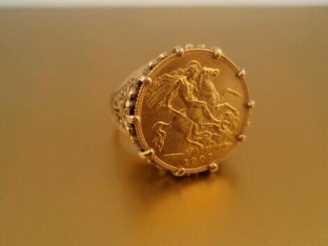 A half sovereign set dress ring