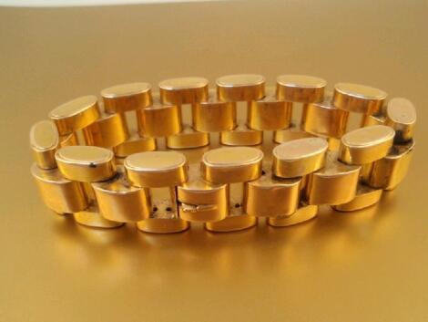 A very large hollow link bi colour metal bracelet