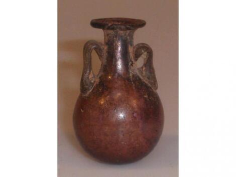 A small purple glass amphoriskos