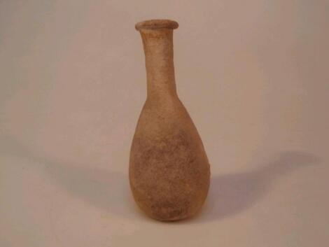 A Roman pinkish-red clay pottery unguentarium