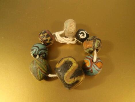 An assorted collection of Roman and Islamic polychrome glass beads