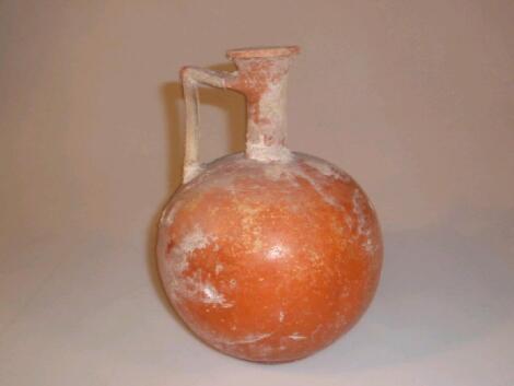 A Roman Eastern Sigillata Ware pottery single-handled jug in light orange