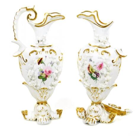 A pair of Rockingham red Griffin ewers