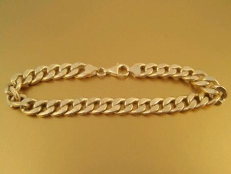 A 9ct gold hollow curb link bracelet marked 375 and import marks