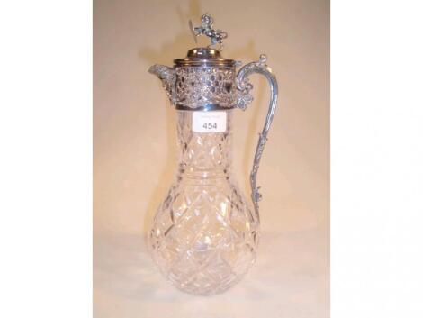 A cut glass and silver plated claret jug