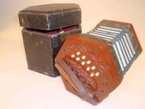 A Enderby twenty one button concertina with mahogany ends and green leather bellows