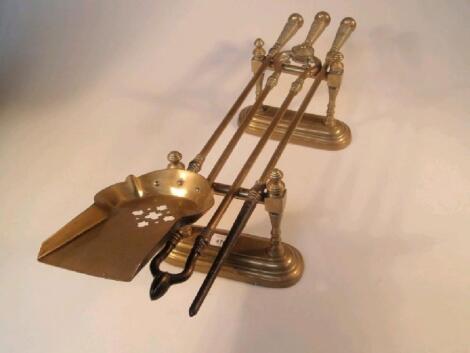 A set of three Victorian brass fire irons comprising shovel