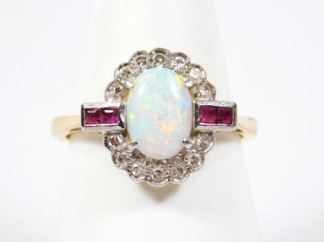 An 18ct gold diamond opal and ruby dress ring