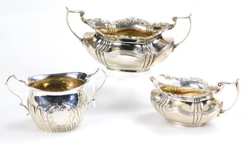An Edward VII silver cream jug and sugar bowl