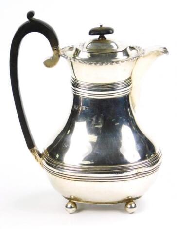 A George V silver hot water jug