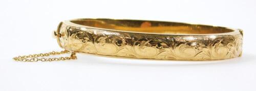 A 9ct gold bangle